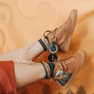 Bangs embroidered high tops.